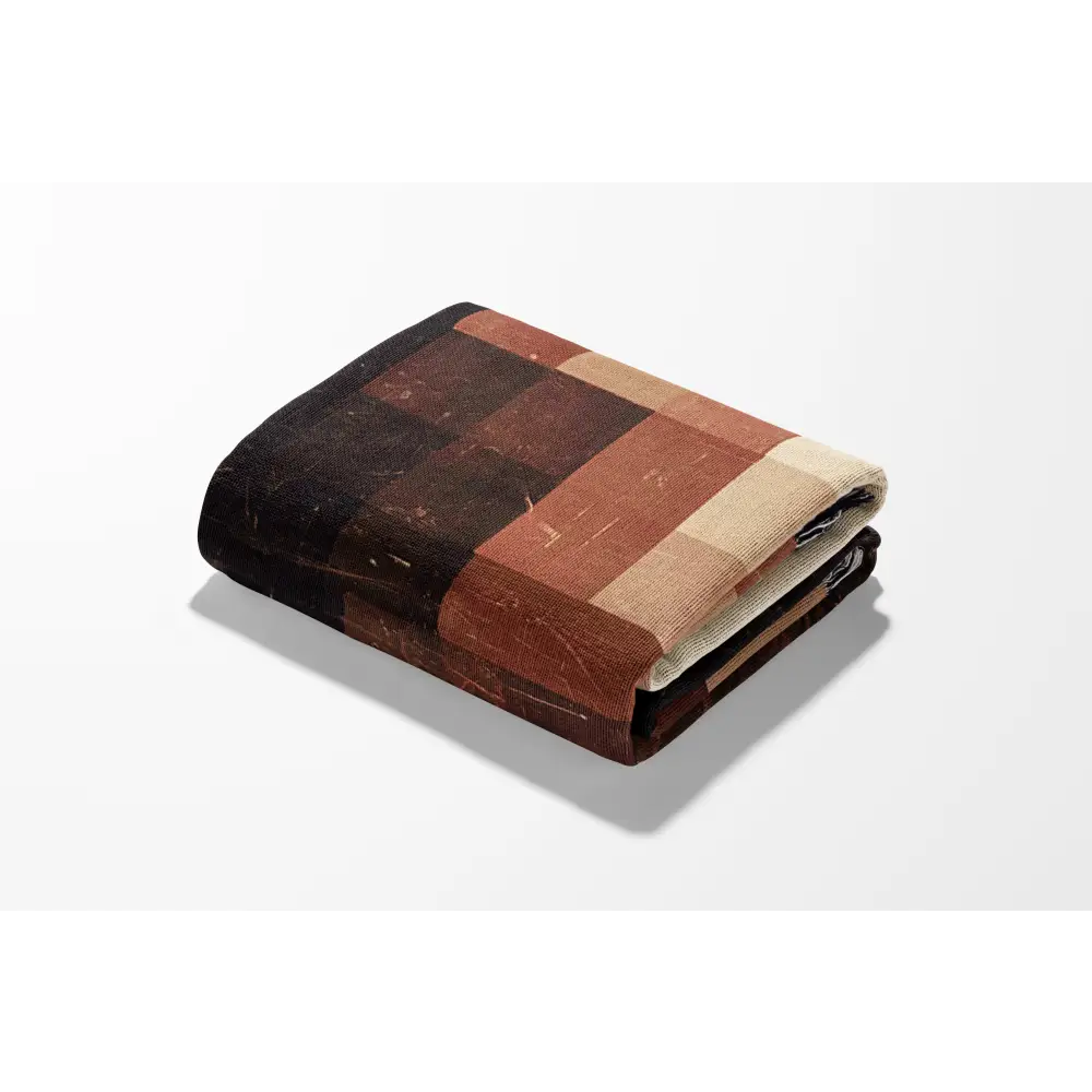 Folded checkered blanket showcasing Abstract Shapes Personalized Woven design