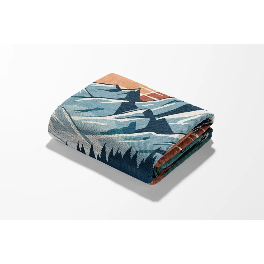 Folded sunset trail personalized woven blanket featuring a mountain design